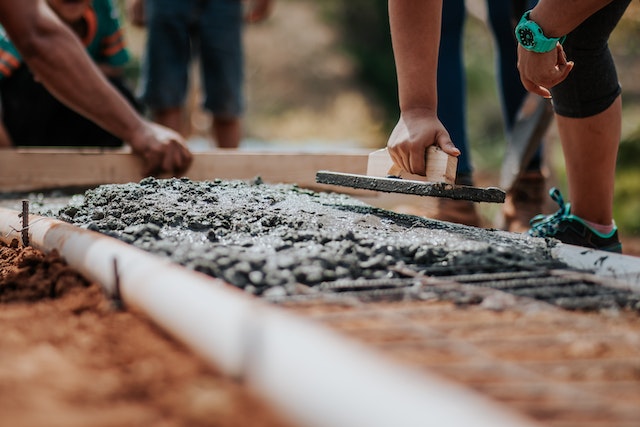 People working together to build a house foundation